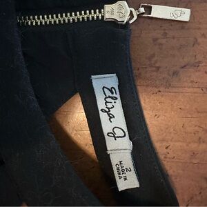 Eliza J Women’s sz 2 form fitting below knee length dress with cutouts gold zip